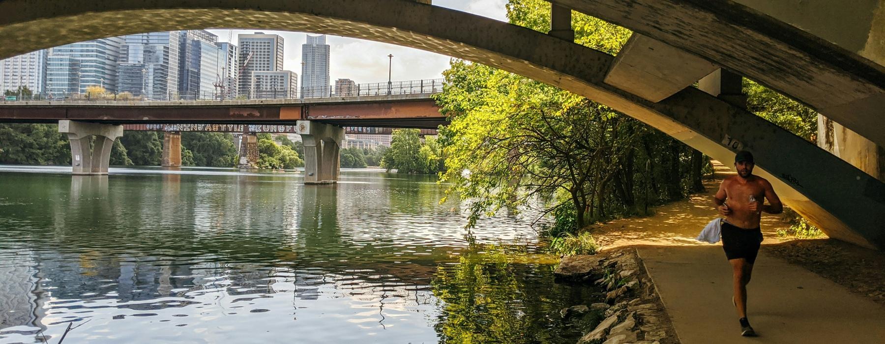 a person walking under a bridge