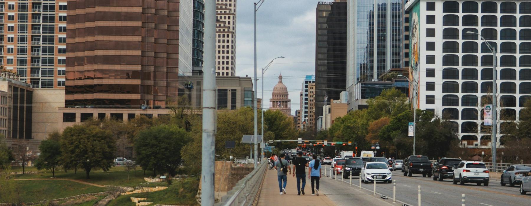 a city street with tall buildings